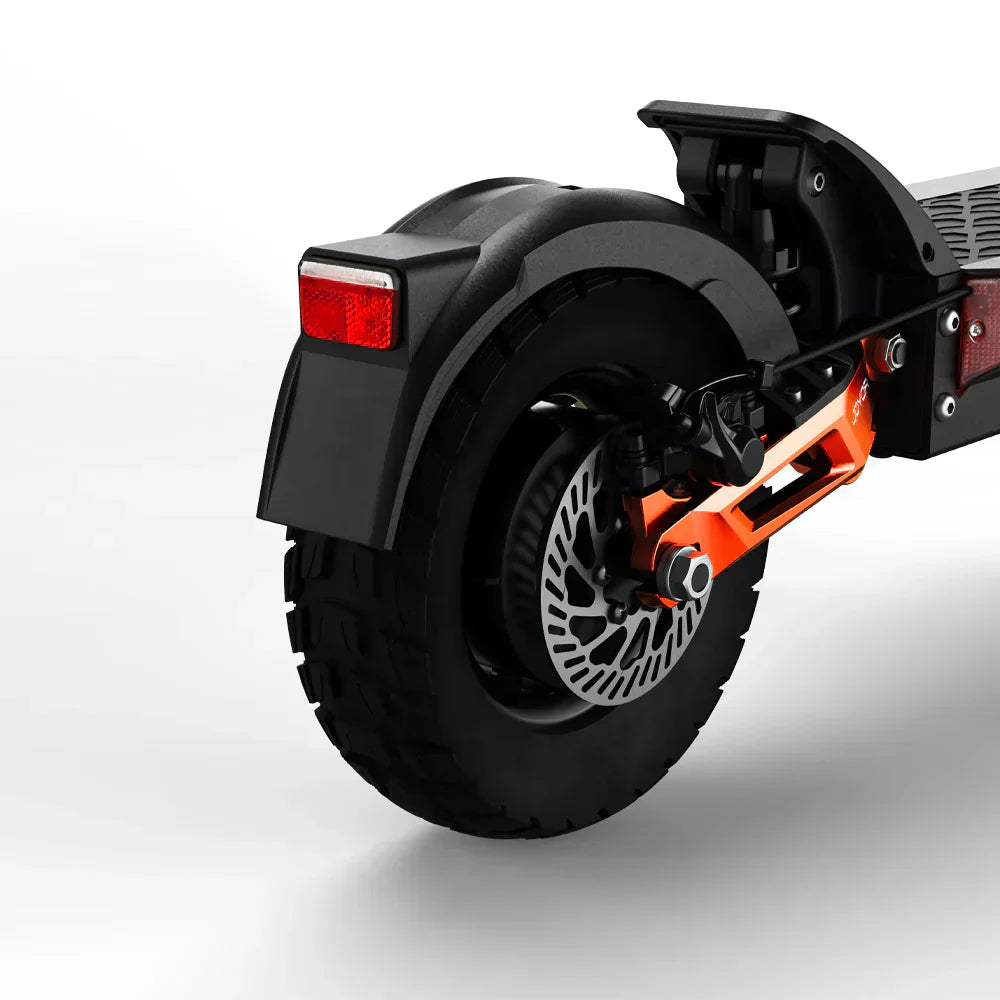 Close-up of a scooter's rear wheel and suspension system on a white background