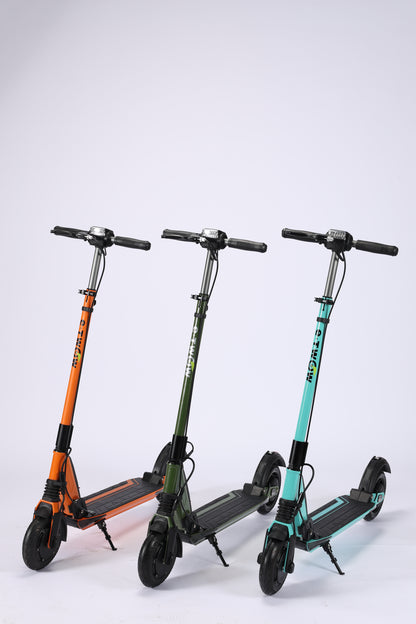 Three folding scooters of different colors on a white background